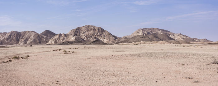 Panoramic view of the desert and mountains in ras al jinz area, sultanate of oman