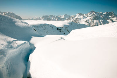 Snow covered mountains against sky