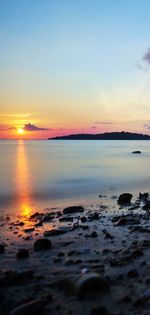 Scenic view of sea at sunset