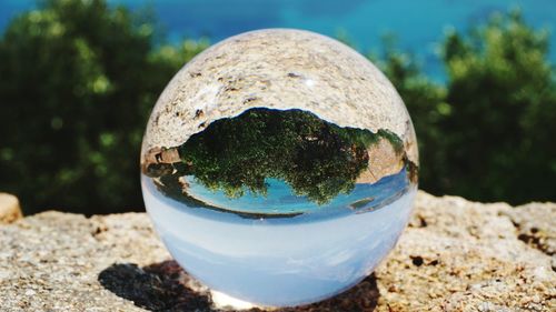 Close-up of crystal ball on glass