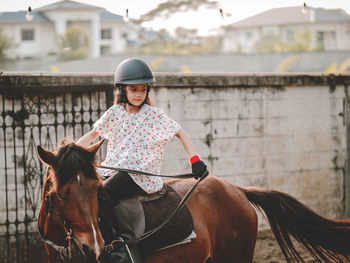 Girl riding horse