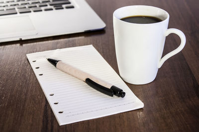 Close-up of coffee cup on table