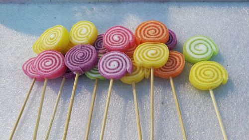 High angle view of colorful lollipops on ice