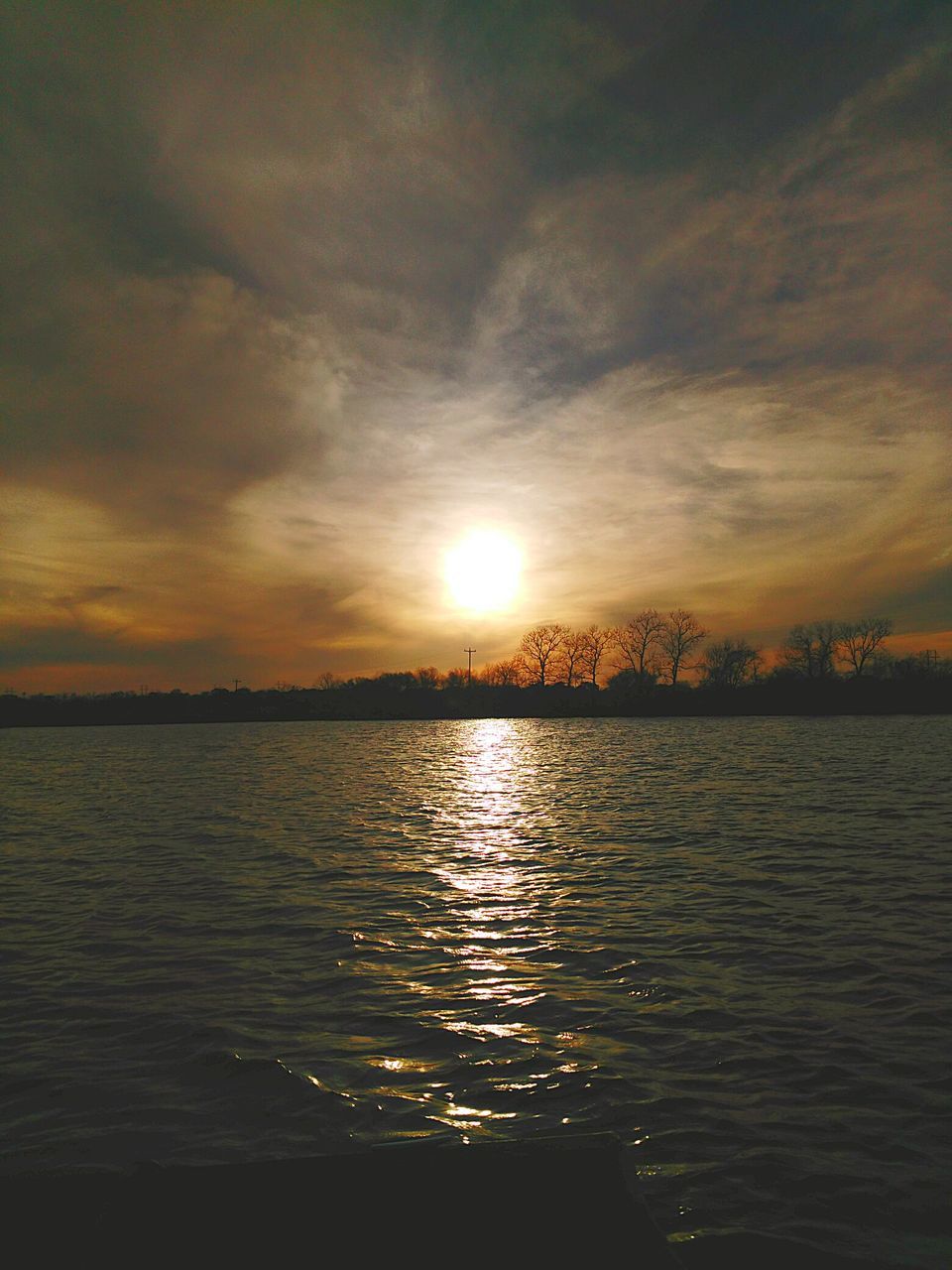 sunset, water, sun, sky, tranquil scene, scenics, tranquility, reflection, beauty in nature, silhouette, cloud - sky, waterfront, nature, orange color, idyllic, lake, rippled, sunlight, cloud, river