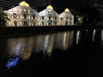 Illuminated building in city at night