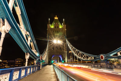 Illuminated bridge at night