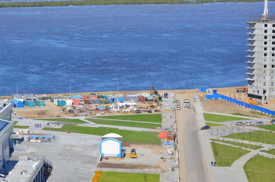 High angle view of buildings by sea