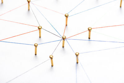 Close-up of telephone pole on white table