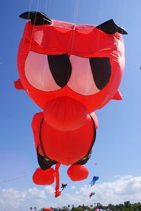 Low angle view of balloons against sky