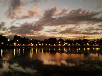 Scenic view of lake against sky at sunset