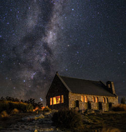 Buildings against sky at night