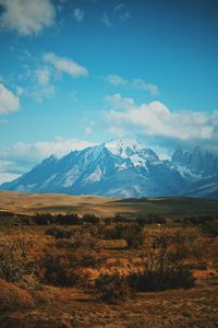 Scenic view of snowcapped mountains against sky