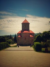 View of bell tower against cloudy sky