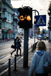 People walking on road in city