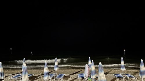 Panoramic view of beach against clear sky at night