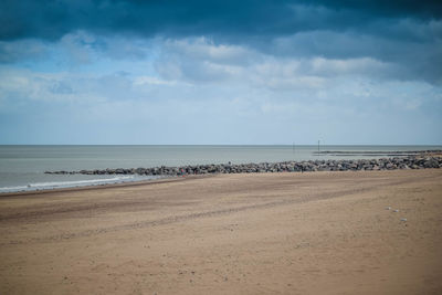 Scenic view of beach against sky