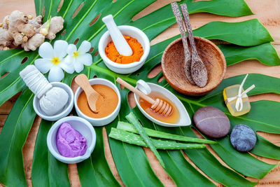 High angle view of natural beauty products on leaf