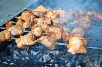 High angle view of meat on barbecue grill