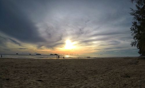 Scenic view of beach against sky during sunset