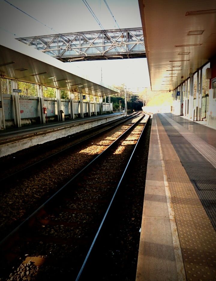 railroad track, rail transportation, transportation, railroad station platform, railroad station, indoors, no people, architecture, sky, day