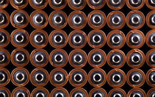 Full frame shot of cans on black background