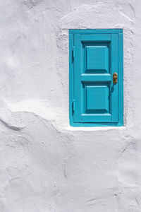 Closed blue window on building