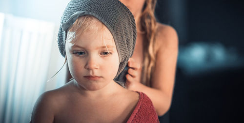 Portrait of shirtless boy at home