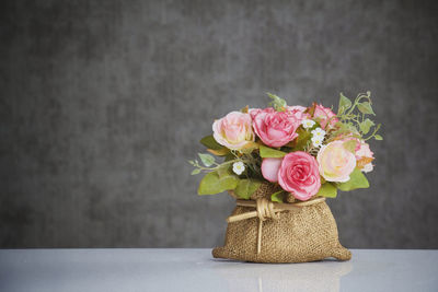 Close-up of pink roses on table