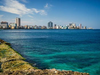 View of cityscape against blue sky