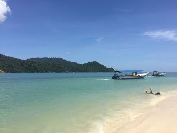 Scenic view of sea against blue sky