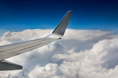 Low angle view of airplane flying in sky