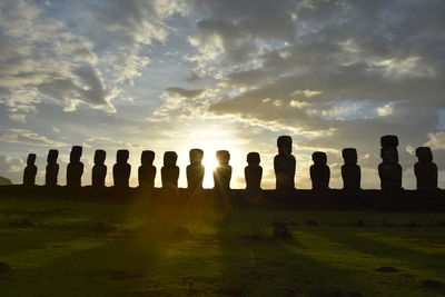 Row of columns against sky during sunset