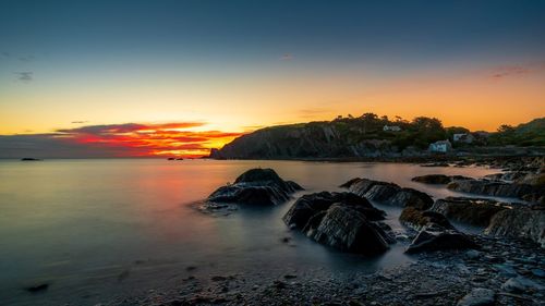 Scenic view of sea against sky during sunset