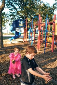 Children playing on slide at playground