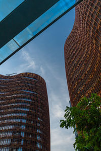 Low angle view of modern buildings against sky