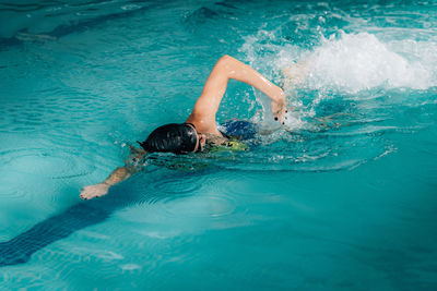 High angle view of woman swimming in sea