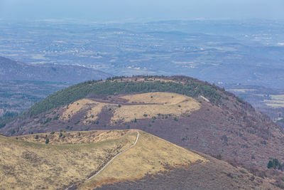 High angle view of road by land against sky