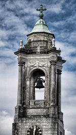 Low angle view of bell tower against sky
