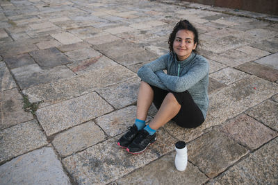 Happy girl resting after exercise