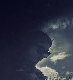 Portrait of woman in sunglasses against sky