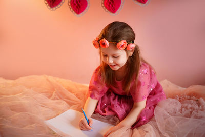 Girl writes a valentine