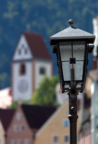 Close-up of street light against building