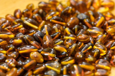 Full frame shot of roasted coffee beans on table