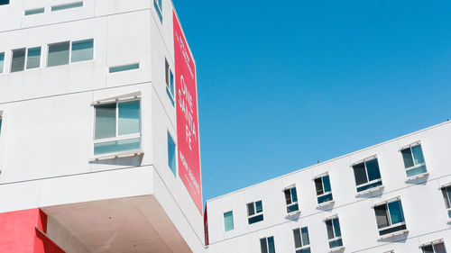 Low angle view of building against clear blue sky