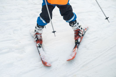 Rear view of person skiing on snow