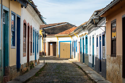 Alley amidst buildings in city