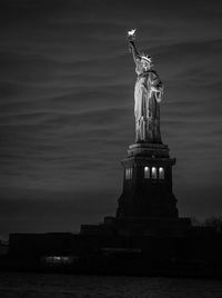 Low angle view of statue at night