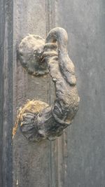 Close-up of statue against door