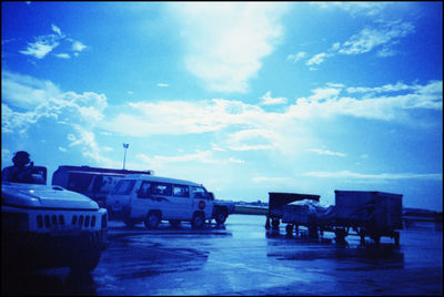 Airplane on runway against sky