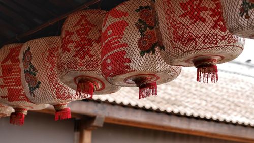 Low angle view of lanterns hanging on roof